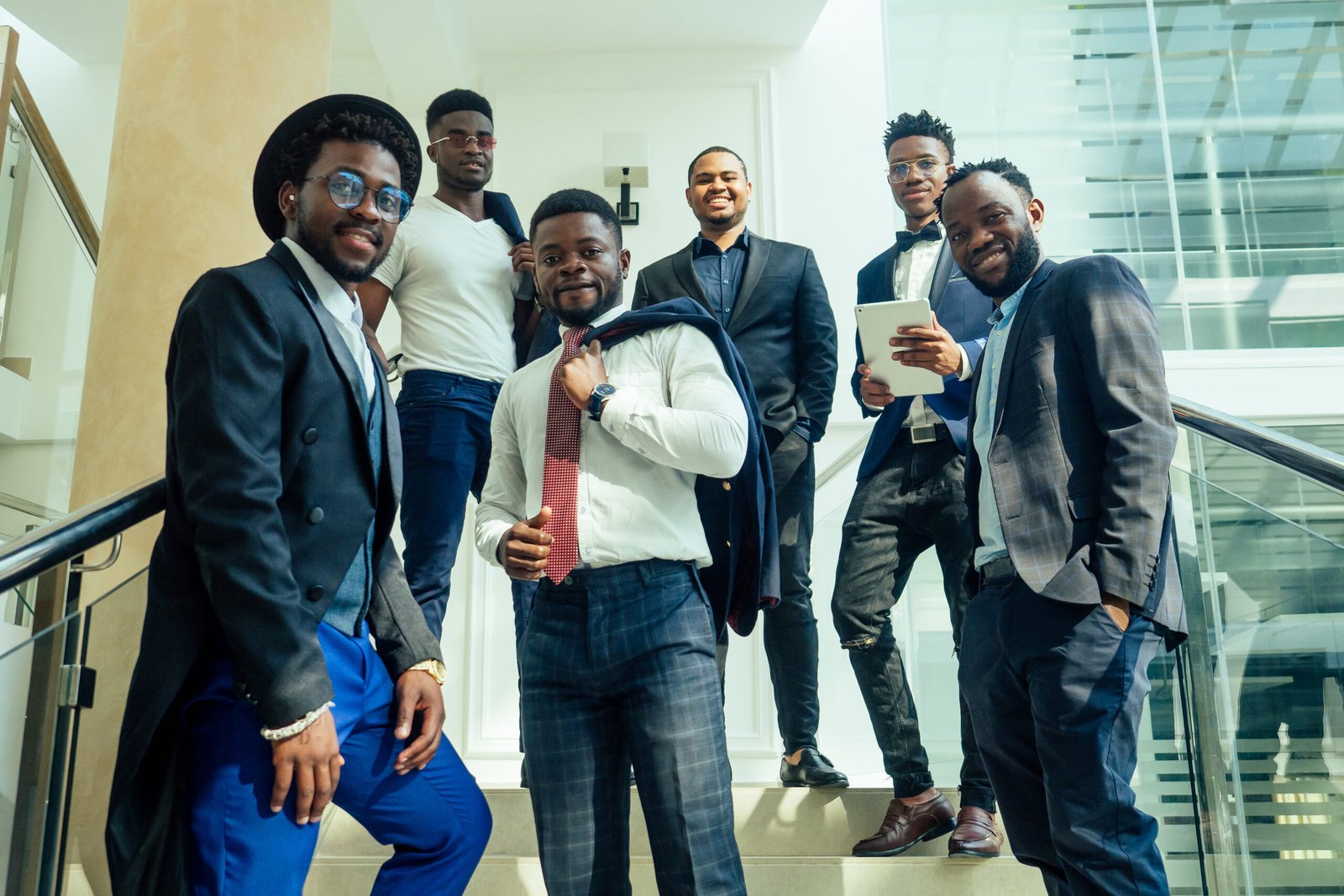 international group of nine african american and indian people having a rest after brain storm in big office.